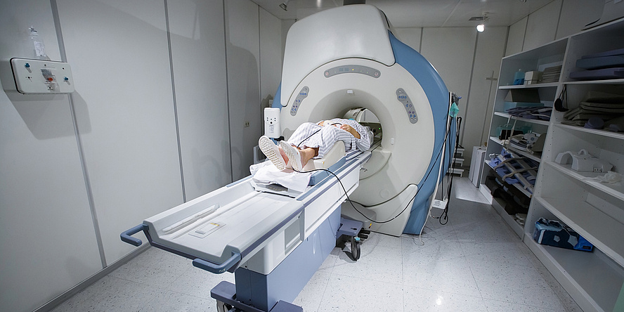 A patient is put into an MRI machine.