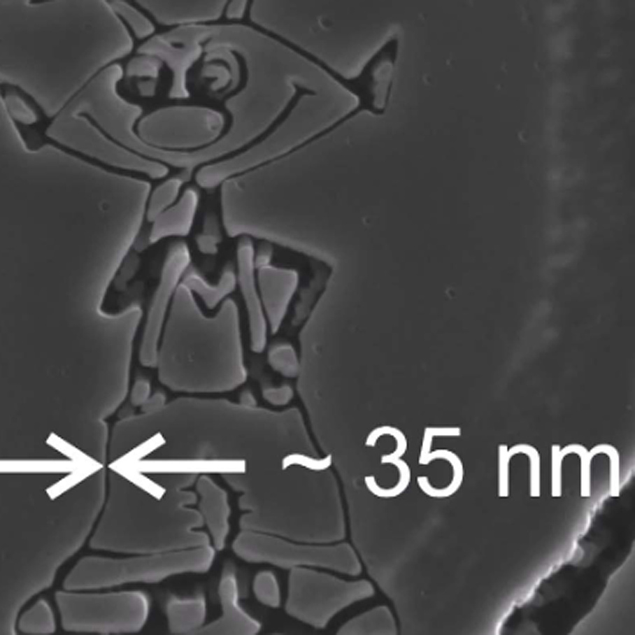 SEM images of a human hair, in which a comic figure is milled 