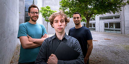 Three researchers with laptop