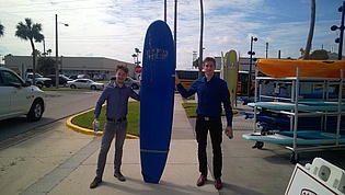 M. Schriefl and B. Lang with a surfboard.