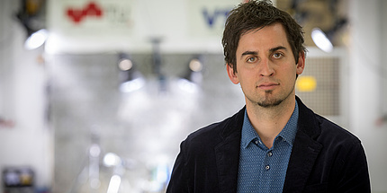 Young researcher Christian Ellersdorfer in the test hall at the Institute of Vehicle Safety.