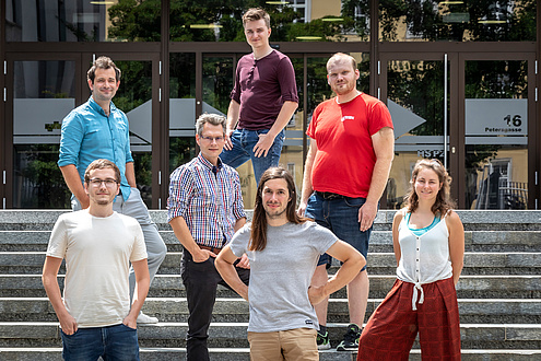 Group of researchers on a flight of stairs