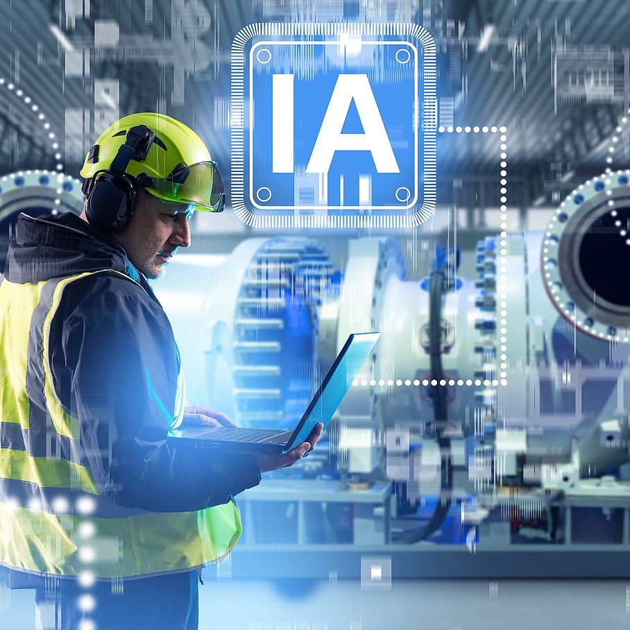 Ingenieur, der in einer modernen Fabrik einen Laptop mit KI verwendet