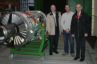 Prof. Heitmeir, Mr. Haubenhofer and Mr. Antonitsch (from the left) next to the cut-off model of the Saab Draken jetengine at the institute.