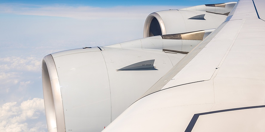 Airplane wing in the sky.