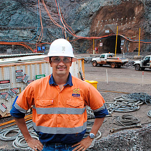 Neil Bar in front of a tunnel construction site