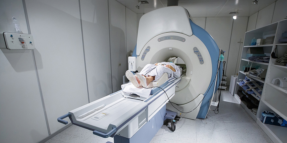 A patient is examined in an MRI.