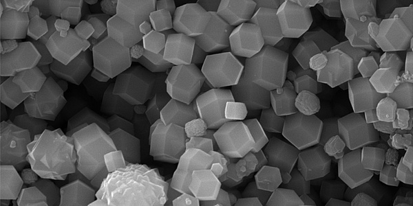 Many small white cubes on a black-and-white image.