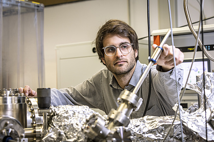 A man in a physics laboratory