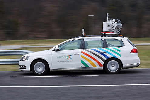 Research vehicle with surveying equipment on the roof