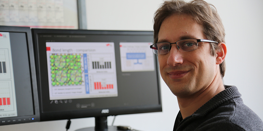 Researcher in front of screen