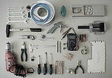 Various tools, such as pliers, a hammer, several screwdrivers.
