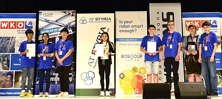 People are standing on a stage.