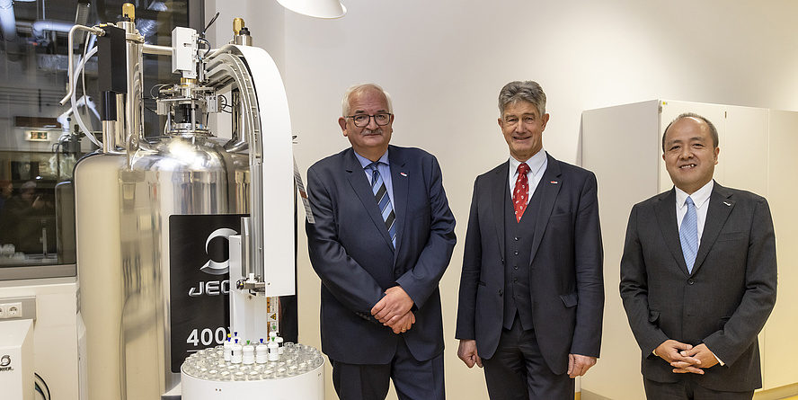 Three men at a lab.