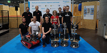 Two successful TU Graz robotic teams; also showing at the picture rescue robot Wowbagger of Team TEDUSAR and three logistics robots of Team GRIPS