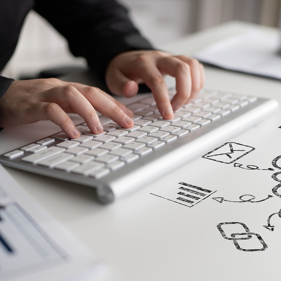 Hands on a computer keyboard