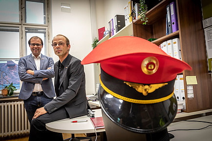 Two TU Graz researchers, in the foreground a conductor's cap