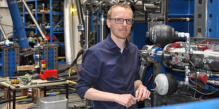 Peter Brunnhofer with an experimental set up in the structural durability laboratory.