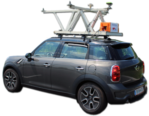 This picture shows a car carrying the platform of the institute with 4 GNSS antennas and receivers and different kinds of inertial measurement units