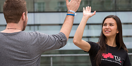 Two students making "give me five"