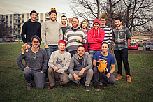 Outdoor group photo with yellow plush animals.