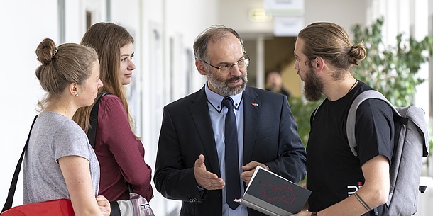 Students talking to a professor