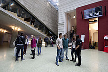 Several people in a foyer area.