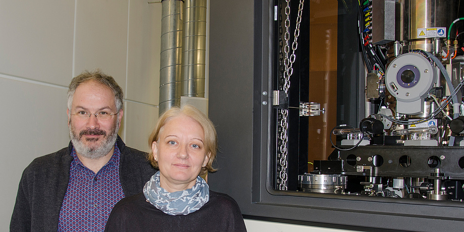 Researcher next to an electron microscope