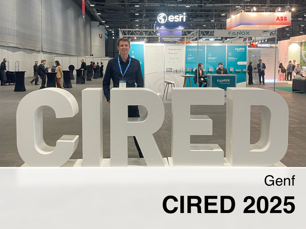 Benjamin behind the letters CIRED at the conference.