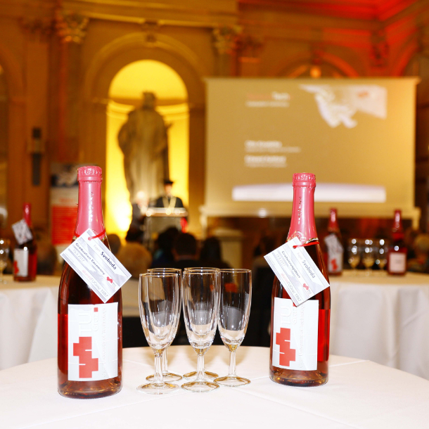 Sparkling wine bottles on a table at an event