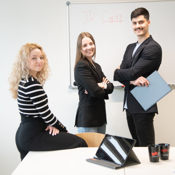 3 students in a meeting room